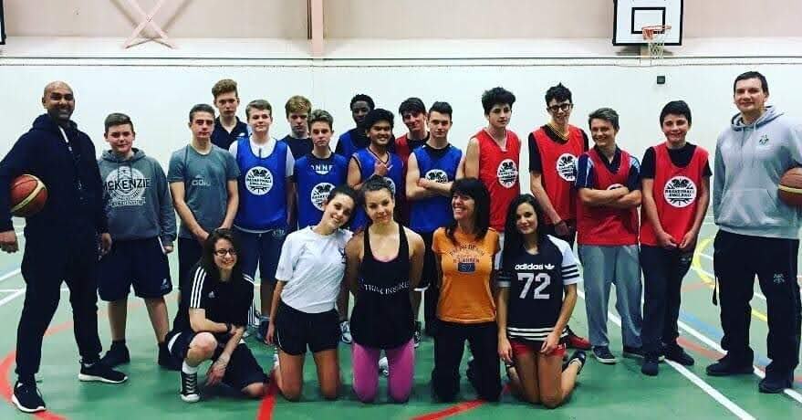 Young people at basketball session